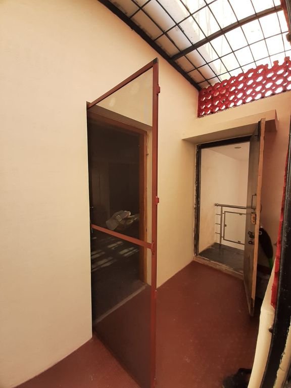 Brown aluminium fly door under a skylight