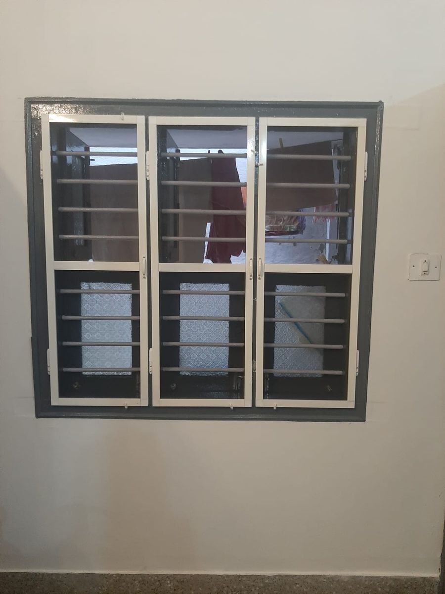 Three-panel window with dark grey aluminium section